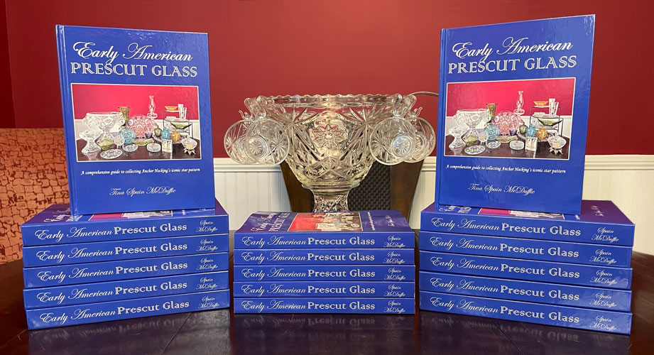 Stack of Books: Early American Prescut Glass by Tina Spain McDuffie in front of her mom's punch bowl set.