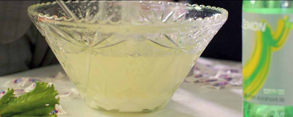 A simple punch made with lemon-lime soda looks lovely in an Early American Prescut Punch Bowl.
